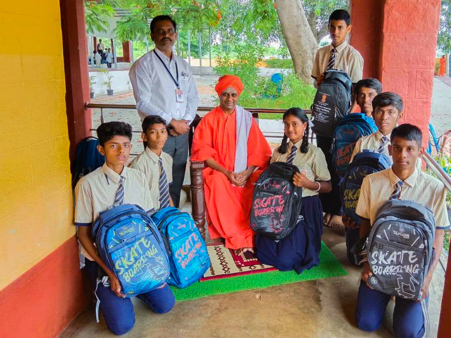 Students with Swamiji and staff at a school setting