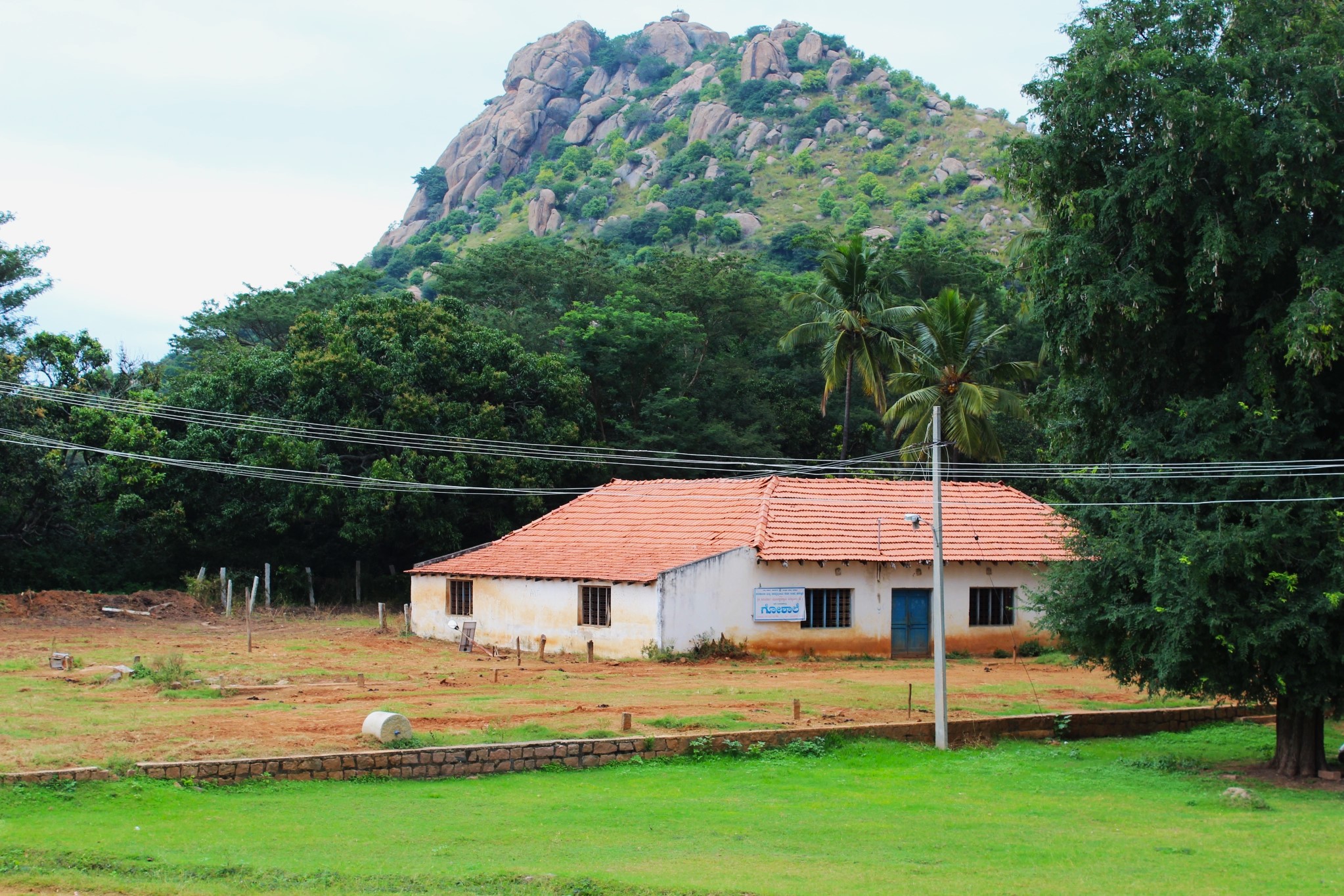 Rocky hill and traditional building at Sri Kshetra Maralegavi